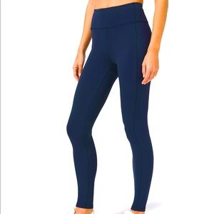 Lululemon Navy Leggings. Zipper pocket on back. 25 inch.